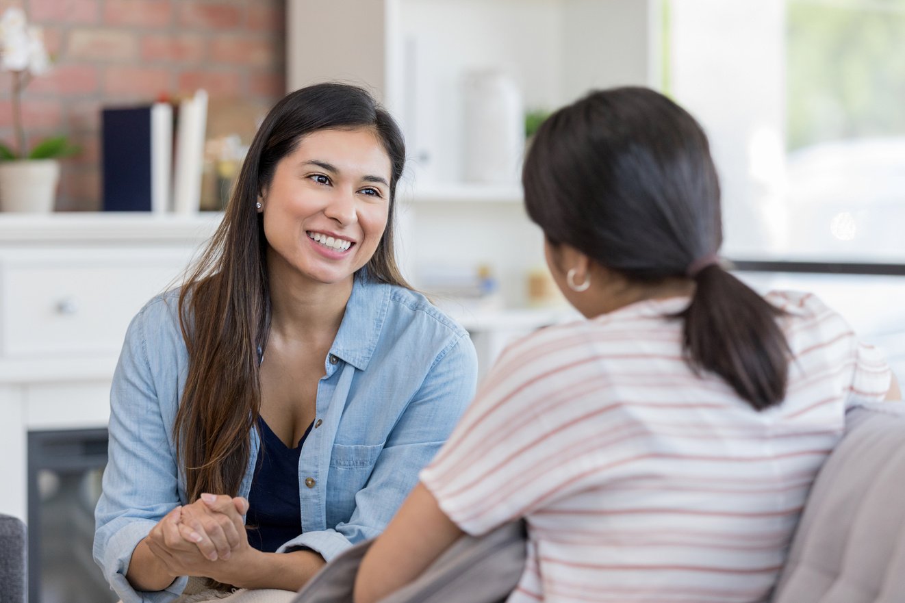 Mid adult mom and teen girl talk about boundaries